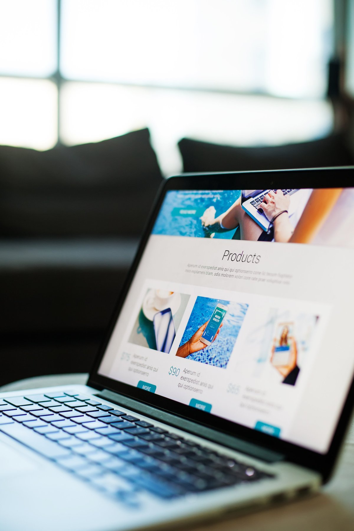Laptop screen showing website homepage with colorful content
